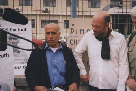 Mordechai in sombre mood outside Department of Justice, Jerusalem just after being served with papers extending his sanctions for a period of 12 months (Ben at side)