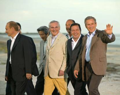 Here led Europe in the mismatching linen suit to walk with the G8 & expand Europe.