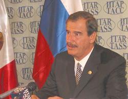 President Vicente Fox of the United $tates of Mexico enjoys his 15 minutes of Fame in Red Square Russia & comments on the poorest peasants of his land...