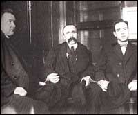 Vanzetti (middle) & Sacco (right) handcuffed together 1923 the man on the left is a Bostonian. (they didn't like Italians or Anarchists)