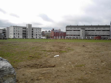 Empty space where new houses were supposed to be built (good spot for a community garden action?)