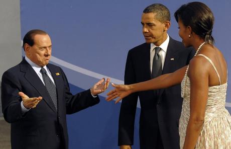 Berlusconi greets the wife of the US president, she didn't hug him causing a diplomatic incident.