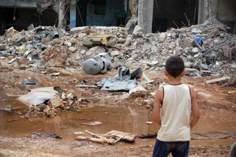 Boy looking at rubble