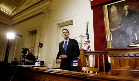 a younger ambitious Obama standing as a Senator in a Senate House Committee room he wasn't a member of.