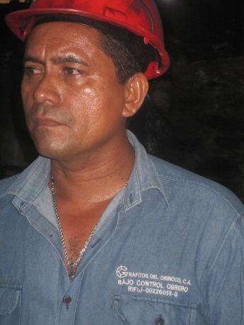 A Grafitos worker, April 2011. His overall reads, Grafitos del Orinoco: Under Worker Control. (Ewan Robertson)