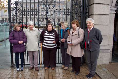 The family with TDs Catherine Murphy and Katherine Zappone before a meeting at the Dil