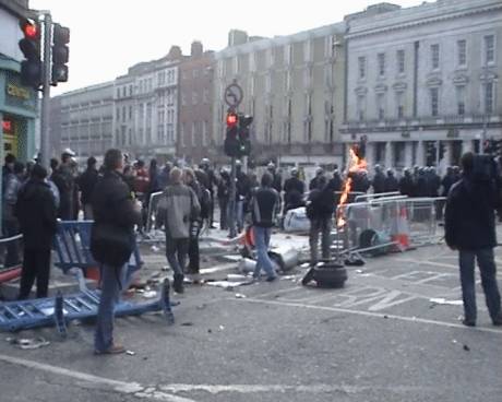 Garda gets hit with a petrol bomb in O'Connell St