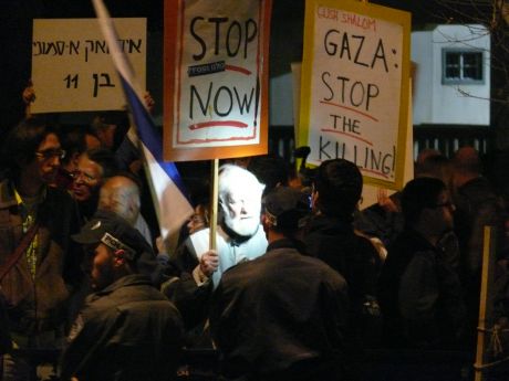 A ghostly Uri Avnery amidst the protestors