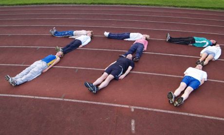 Runners at UCD track in Belfield interrupt their training to help launch the 777 challenge on the 07 of July 2007. The aim of the challenge is to raise 50k for the Irish Cancer Society