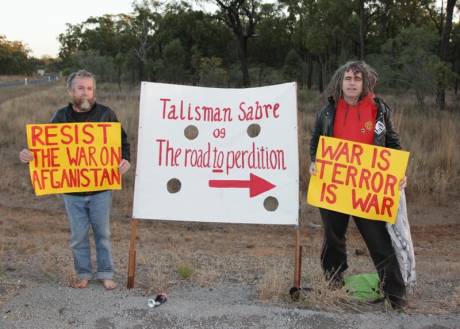 Veteran members of the Catholic Worker movement Jim Dowling and Ciaron O'Reilly prepare to block a major access road to the Talisman Sabre military exercise