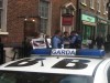 Gardai take activists' details outside the Pearl Brasserie