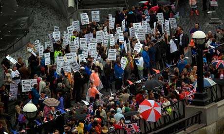 Anti-monarchy protesters gather on the banks of the river Thames at city hall, London. Photograph: Peter Macdiarmid/PA