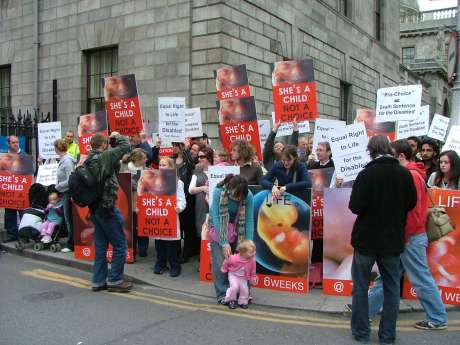 pro-life demonstration on pavement opposite