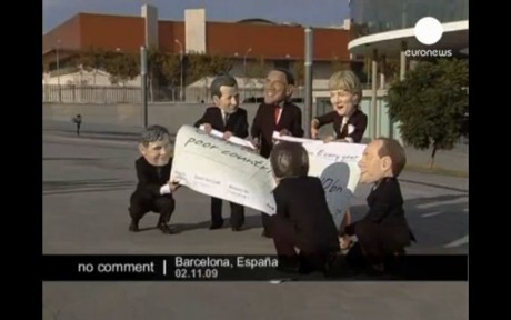 Action outside the conference - World leaders draw up aid cheque to poor countires, then rip it up