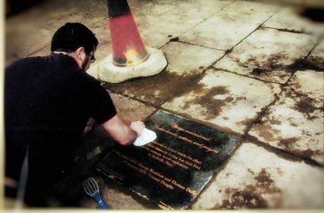 A close up of Tom working on the plaque in 2004