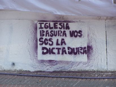 "Church, you Trash, you are the Dictatorship". Graffiti makes reference to the Church's collaboration with state terrorism.