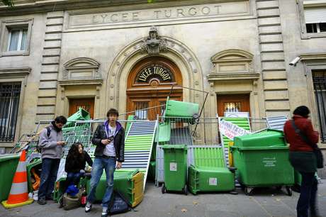 High school students block the entrance to the Lyce Turgot in Paris