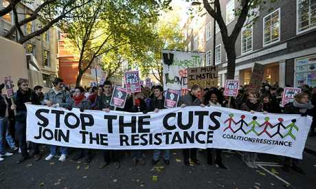 UK> 3,000 people gathered in London to protest against the government's public spending cuts.