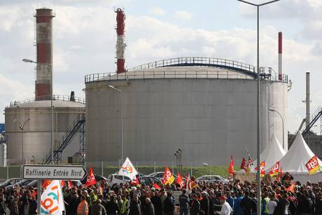 Strikers block the entrance to the Total refinery in Donges
